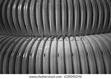 Grooved plastic pipes for background. Image includes a effect the black and white tones.