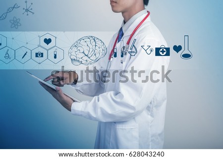 Medicine doctor hand holding stethoscope and working with modern medical icons