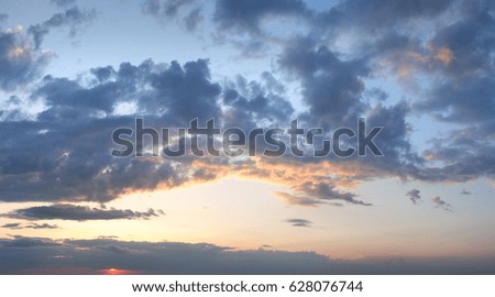 Summer sunset sky view with fleece clouds. Summer evening good weather background. Three shots high-resolution stitch image.