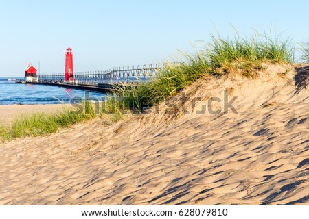 Beach at Grand Haven Lighthouse and Pier Royalty-Free Stock Photo #628079810