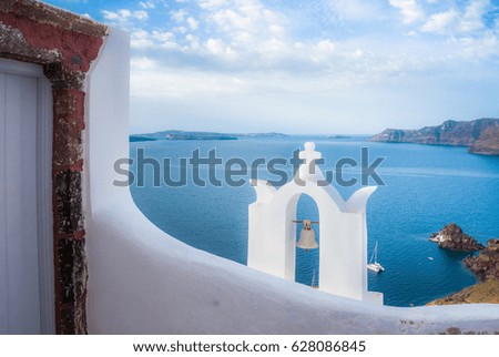 Bell tower of an orthodox church at Santorini, Greece. Honeymoon summer aegean cycladic background.