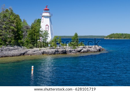 Lighthouse on Great Lakes Royalty-Free Stock Photo #628101719