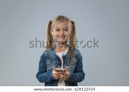 Little Teenage Girl Using Cell Smart Phone, Small Happy Smiling Child Wear Headphones Isolated Over Gray Background