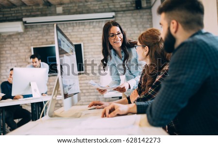 Corporate team working colleagues working in modern office Royalty-Free Stock Photo #628142273