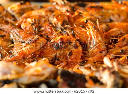 Fried shrimps on a brown paper, Indonesian street food