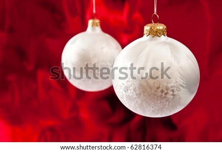Christmas baubles on red background.Studio shot