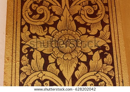 Golden lotus art. Thai art decorated on the temple door.