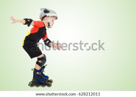Sports little boy riding on roller skates helmet and knee pads. Side view.On a green gradient background.