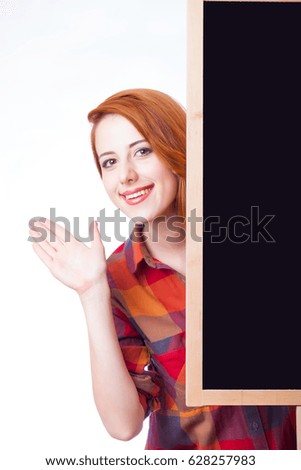 portrait of beautiful young woman with empty board on the wonderful white studio background