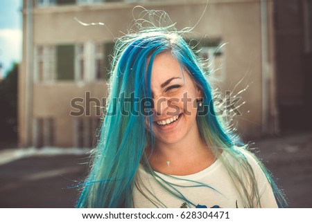 girl with blue hair Royalty-Free Stock Photo #628304471