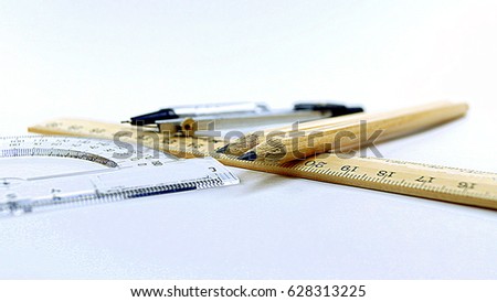 pencils, dividers, ruler, protractor on a white background