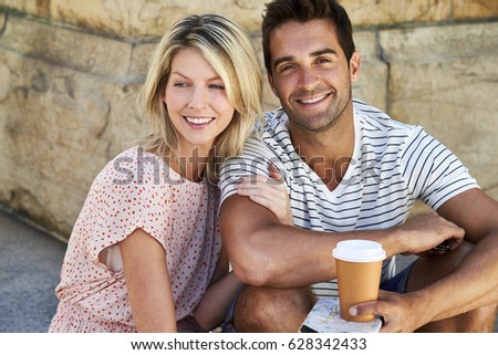 Good looking couple taking a break, smiling