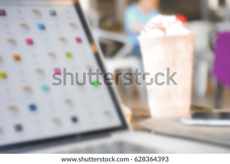 Picture blurred abstract background of laptop and smoothies in c