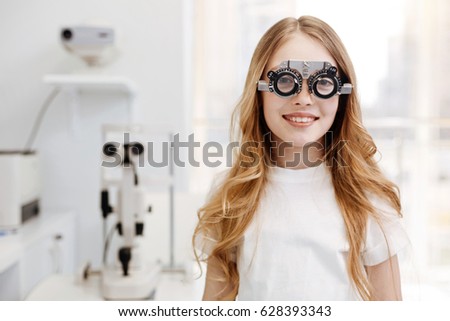 Beautiful teenage girl wearing trial glasses