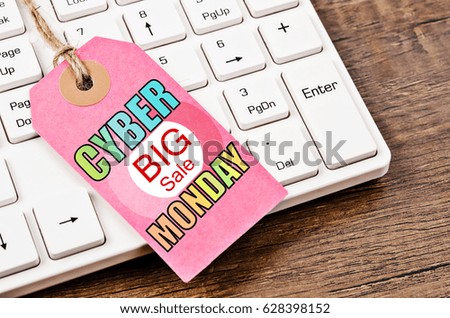Cyber big sale monday label with white computer keyboard on wooden background. Marketing concept.