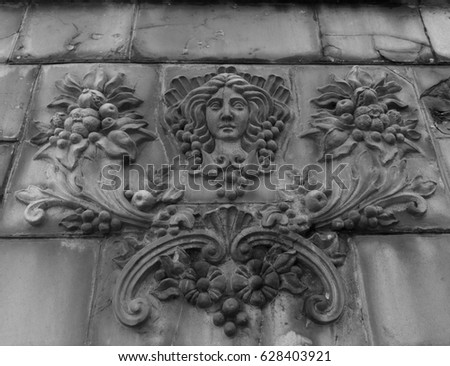 Goddess of fertility relief on a fence