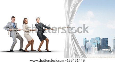 Three businesspeople pulling white blank fabric with rope