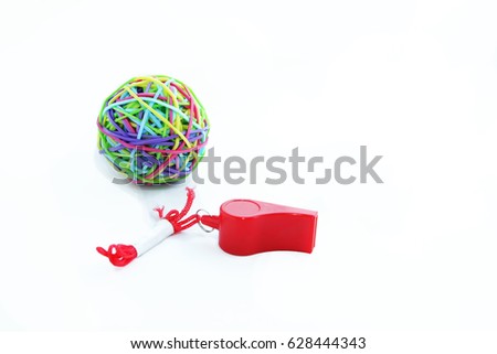 Rubber band ball and red whistle on white background