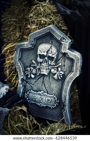 Skeleton on Gravestone Halloween Concept