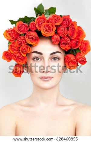Portrait of a girl with a bouquet decoration 50 roses on her head