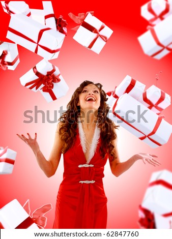 Excited attractive woman with many gift boxes and bags.