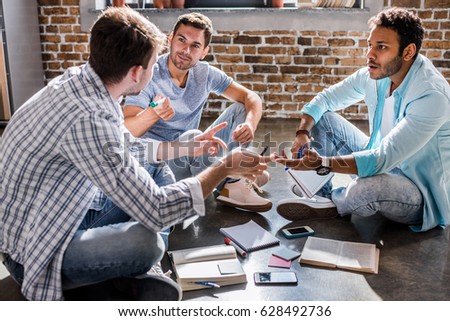 young professional group working on new business project in small business office, small business people concept Royalty-Free Stock Photo #628492736