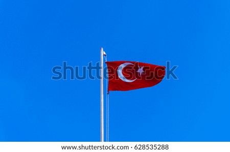 turkish flag waving in blue sky