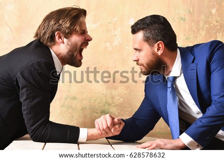 Lawyers arm wrestling by case. Leadership concept