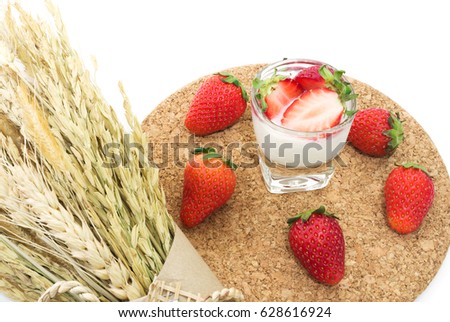 Fresh ripe strawberry and Yogurt on wooden tray