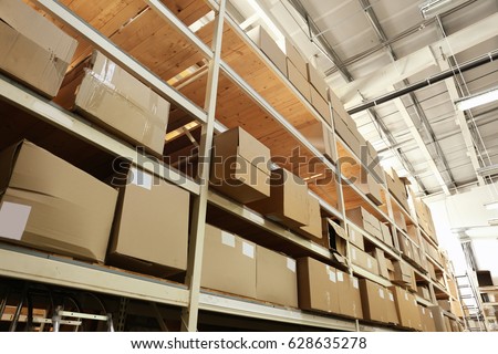 Boxes with goods in wholesale warehouse Royalty-Free Stock Photo #628635278
