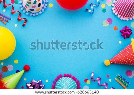 Birthday party background with party hats and streamers Royalty-Free Stock Photo #628665140