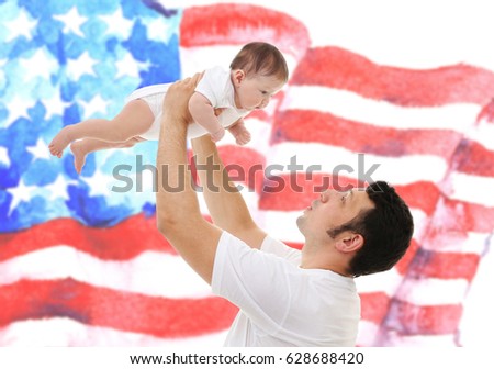 Father with baby on USA flag background