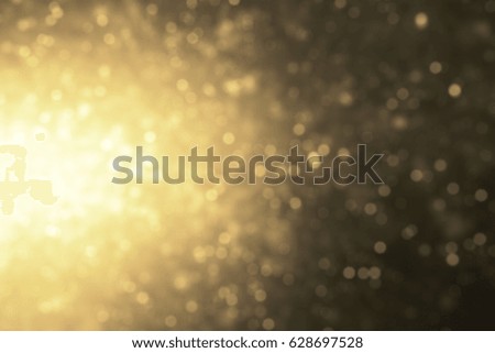 warm yellow glowing glittering lights abstract bokeh background.