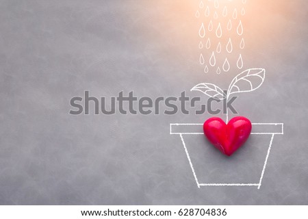 love refresh concept with raining drawing on grey background with red heart object and free copyspace for your text Royalty-Free Stock Photo #628704836