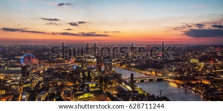 Beautiful sunset over old town of city London with London Eye wheel and bridges over river Thames, England, Europe.