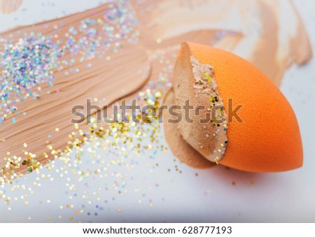 Sponge for make-up with foundation cream Royalty-Free Stock Photo #628777193