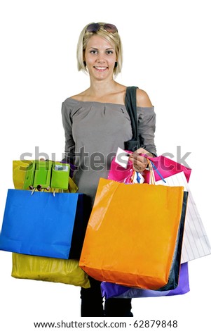Pretty blonde girl carrying color bags from fashion shopping