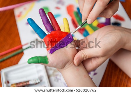 Painting hands of child
