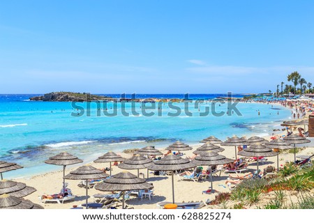 A view of a azzure water and Nissi beach in Aiya Napa, Cyprus Royalty-Free Stock Photo #628825274