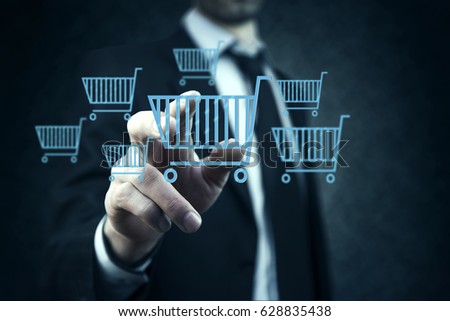 Businessman pressing shopping basket icon over blue background