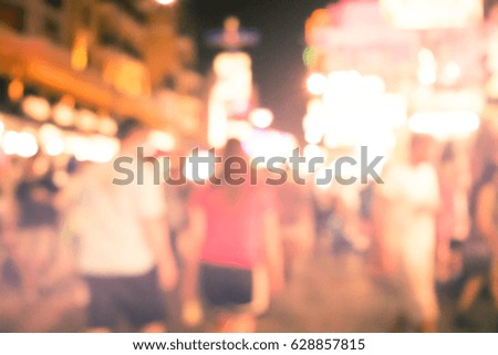 Blurred image of busy night life in the city. Defocused photo of night lights of the famous Ko San Road in Bangkok, Thailand.
