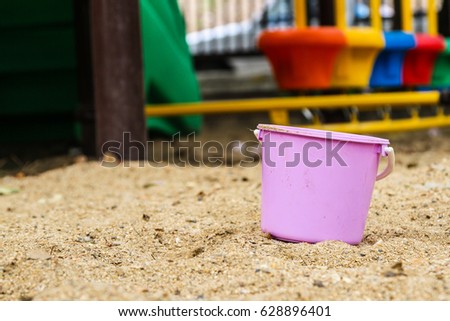 A purple bucket at playground kid zone 