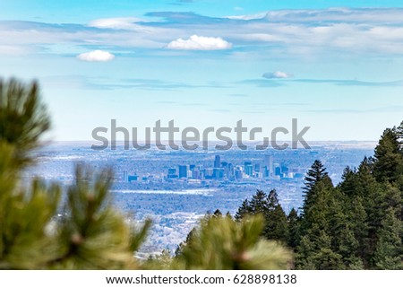 View of downtown Denver Colorado skyline from the top of Lookout Mountain Road in the foothills