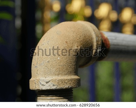 rusty metal elbow pipe texture close up