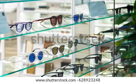 Sunglasses and Fashion Eyewear in a shop window optician. Royalty-Free Stock Photo #628923248