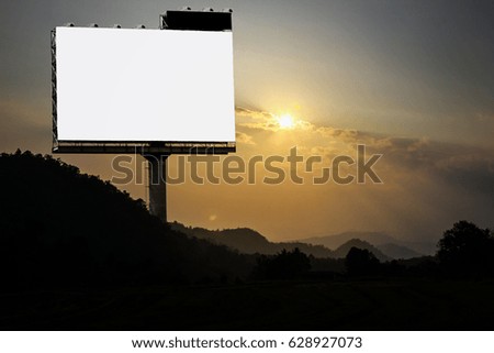 Blank white and black billboard at sunset