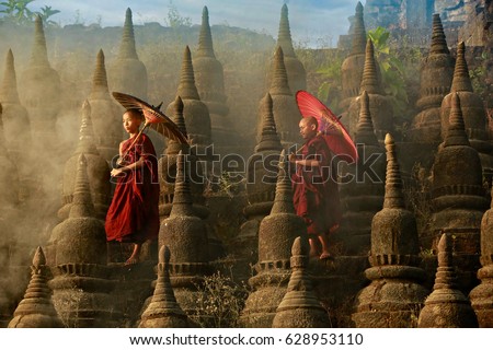 [MYANMAR] Buddhist novice monk are walking in pagoda,myanmar Royalty-Free Stock Photo #628953110