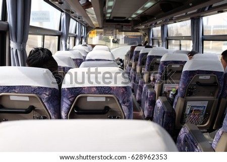 Sapporo bus from Chitose airport, Hokkaido, Japan. A bus (archaically also omnibus, multibus, motorbus, autobus) is a road vehicle designed to carry many passengers. Royalty-Free Stock Photo #628962353