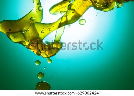 Oil drops in blue water 