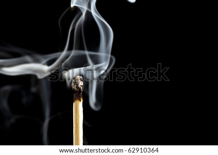 Smoke from a match that was just put out, isolated on black background
